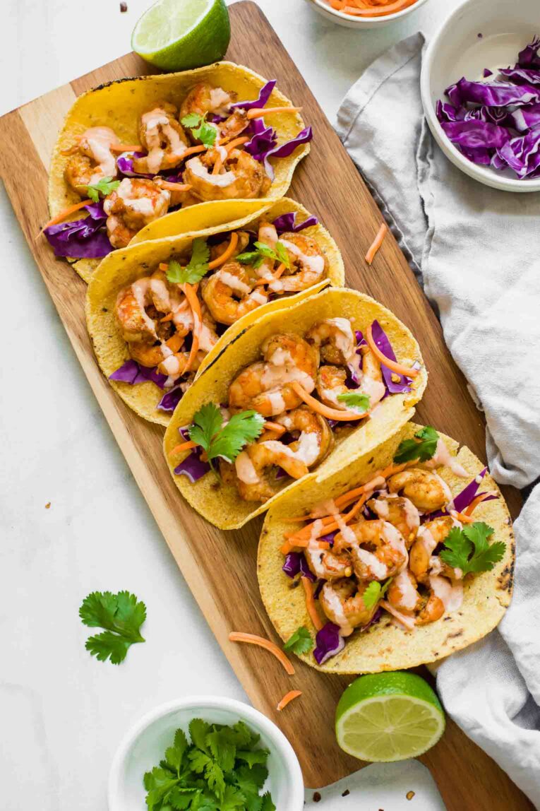 Sriracha Lime Shrimp Tacos on a cutting board.