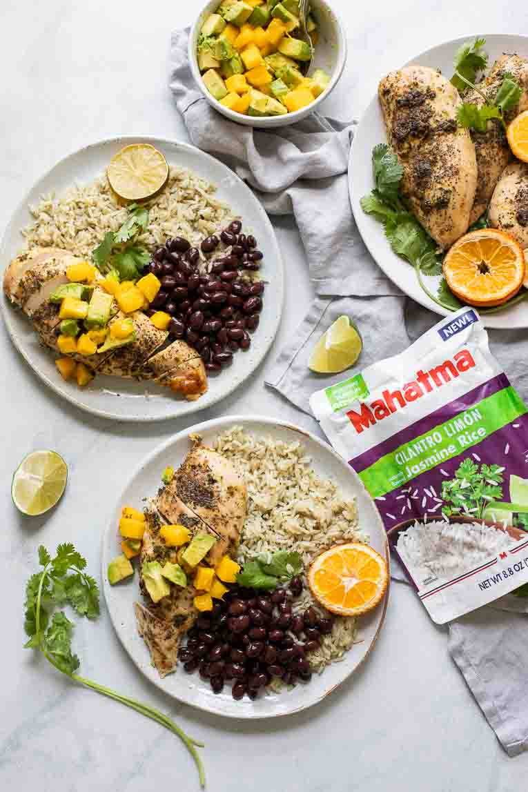 Plates of Cuban Mojo Chicken and Rice with Mahatma Cilantro Lime rice pouch.