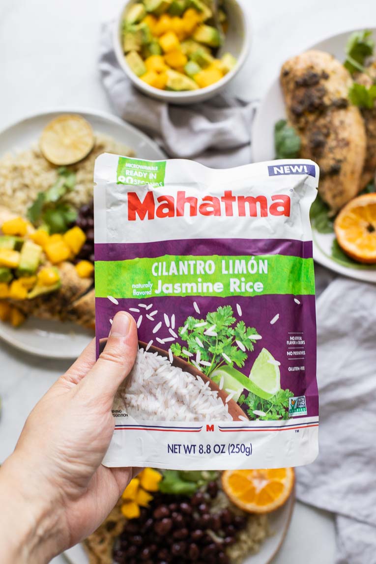 Hand holding Mahatma Cilantro Limon Rice.