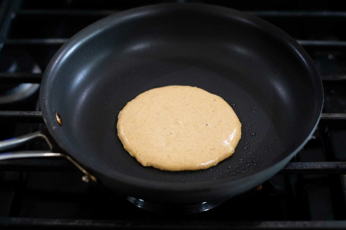 Pancake batter poured into a hot pan.