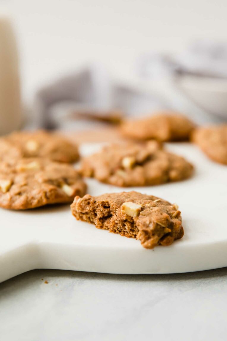 Bite taken out of apple cinnamon oatmeal cookie.
