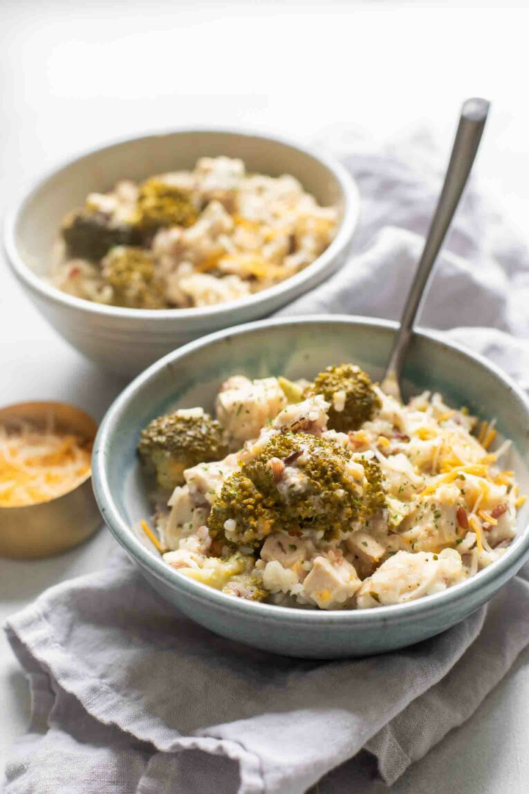 Angled shot of Crockpot Chicken and Rice in a cozy bowl.