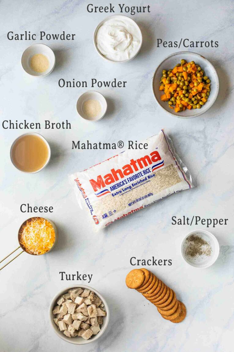 Ingredients on a marble board for Turkey Rice Casserole.