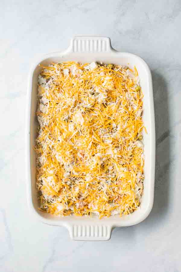 Turkey Rice Casserole topped with cheese in a casserole dish.