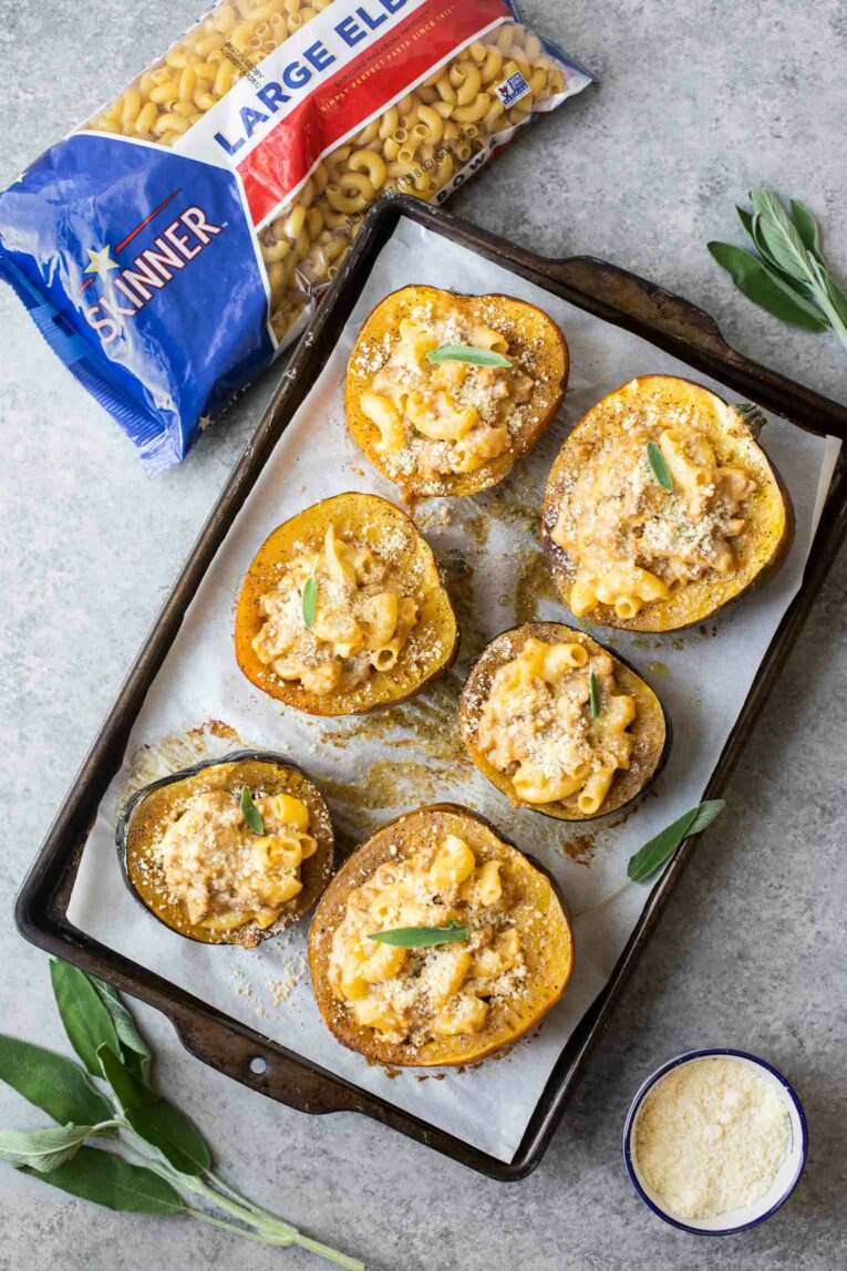 Mac and cheese stuffed acorn squash next to Skinner pasta.