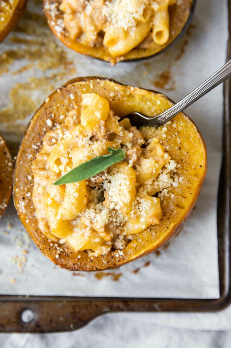 Close up of acorn squash stuffed with mac and cheese.