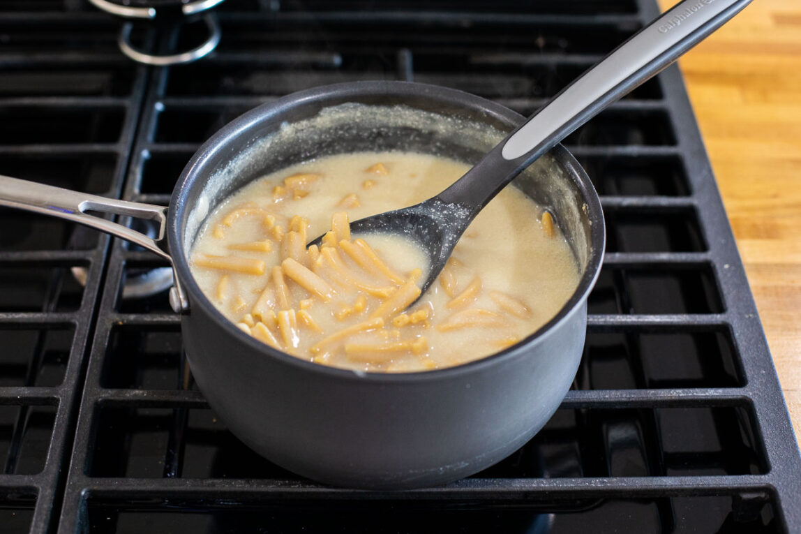 Banza pasta cooking in a pot.