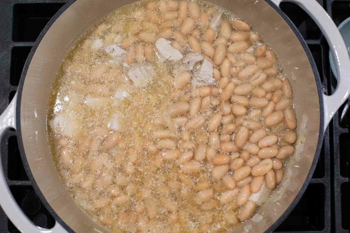 White beans being cooked for chili.
