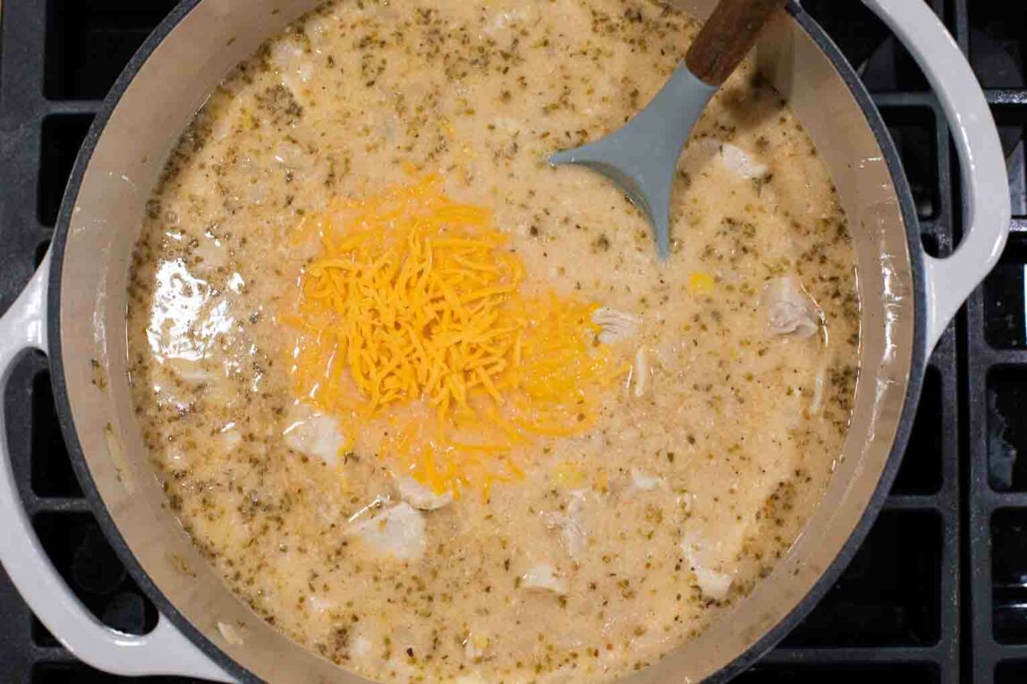 White chicken chili being cooked in a dutch oven.