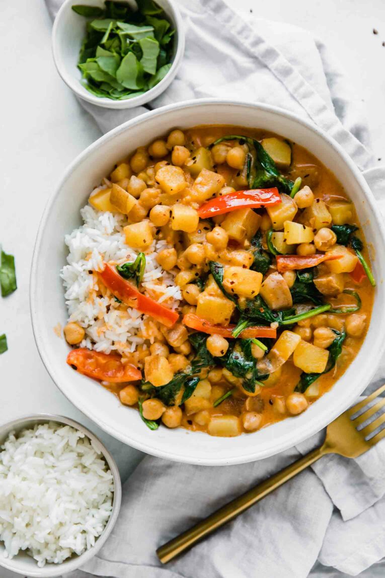 Top shot of Easy Vegan Potato Curry in a white bowl.