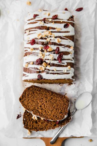 Top shot of healthy gingerbread loaf drizzled with white chocolate.