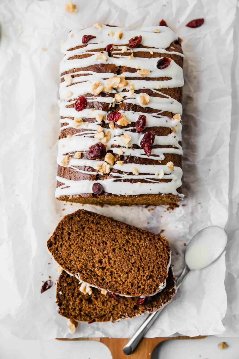 Top shot of healthy gingerbread loaf drizzled with white chocolate.