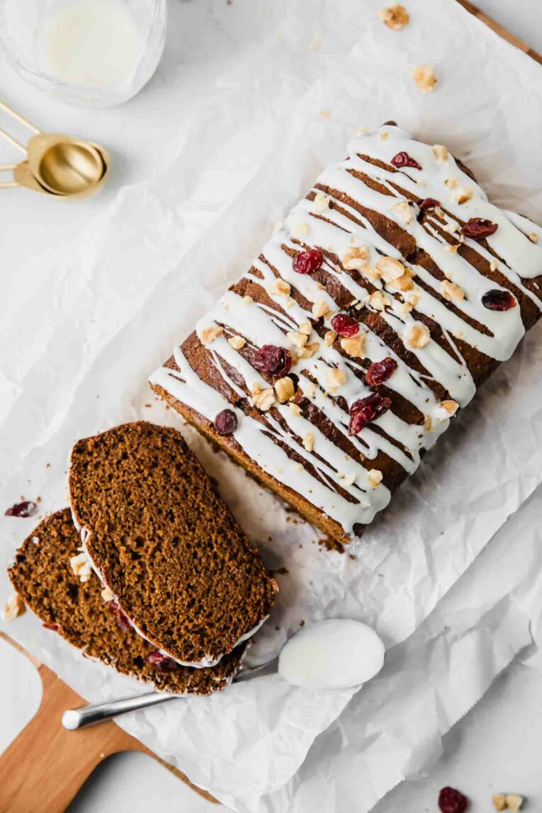 Top shot of a Gingerbread Loaf recipe drizzled with white chocolate.