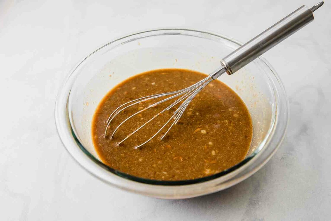 Liquid ingredients for gingerbread recipe in a glass bowl.