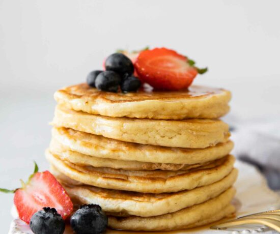 Yogurt pancakes stack topped with berries.