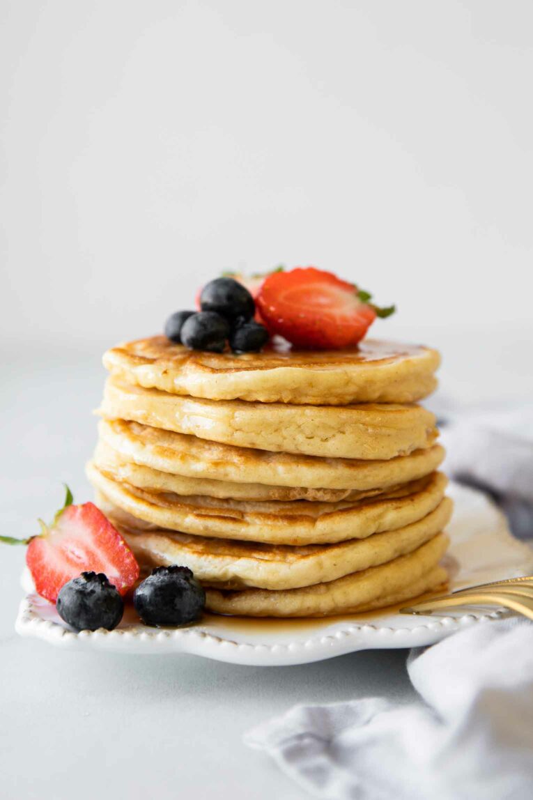 Yogurt pancakes stack topped with berries.
