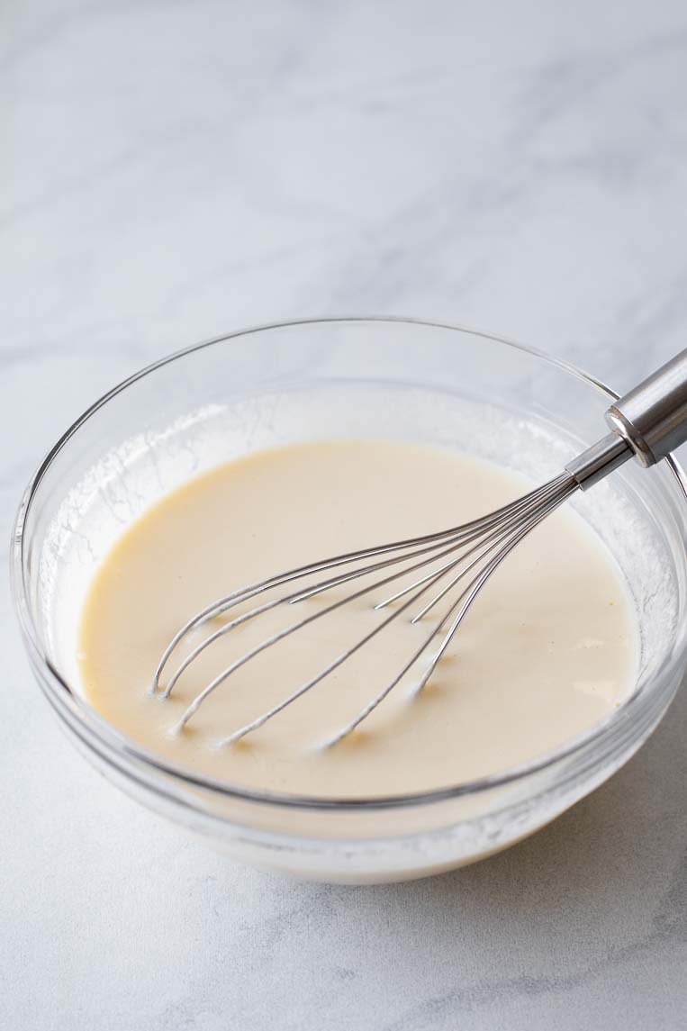Liquid ingredients for pancake batter whisked together.