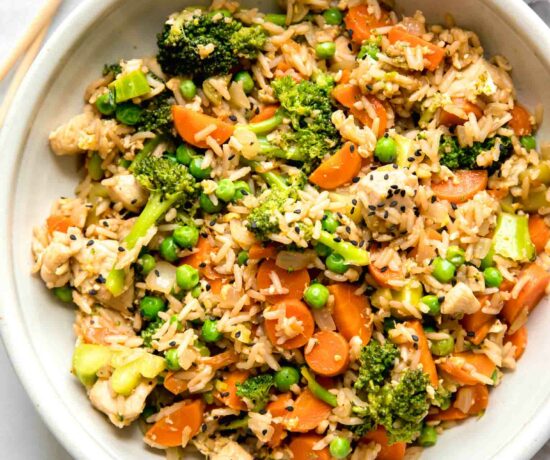 Top shot of Instant Pot Chicken Fried Rice recipe in a white bowl.