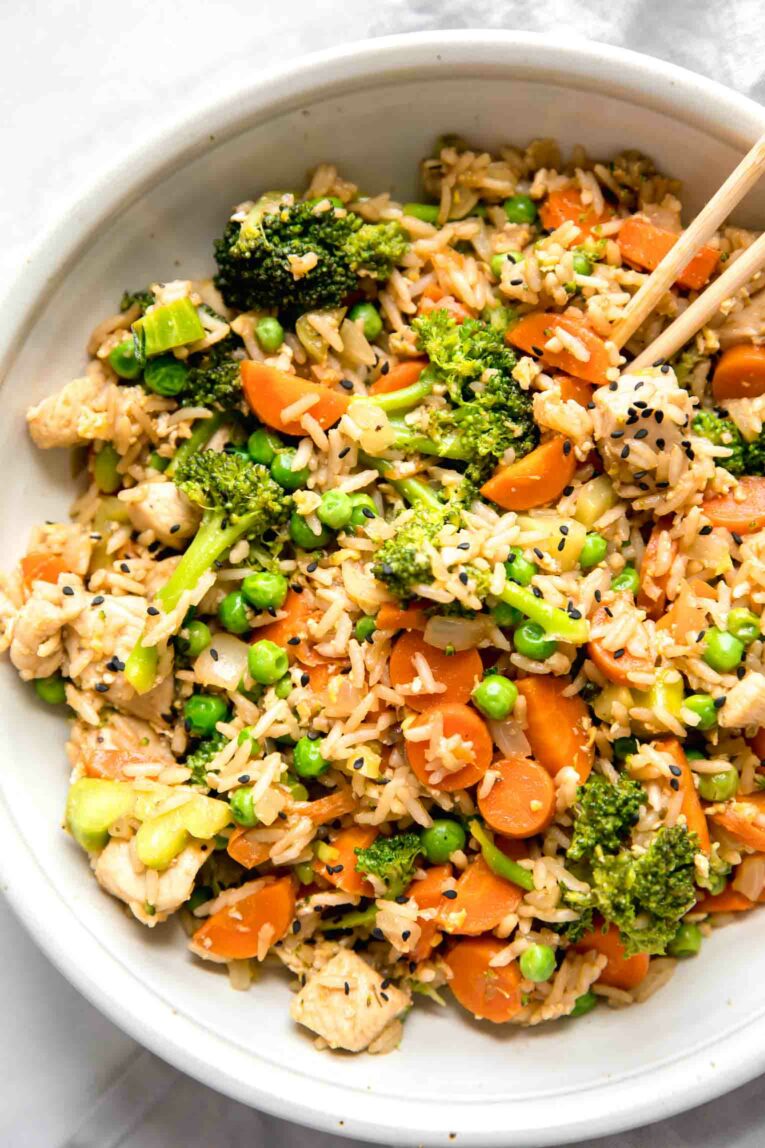 Close up of Instant Pot Chicken Fried Rice in a white bowl.