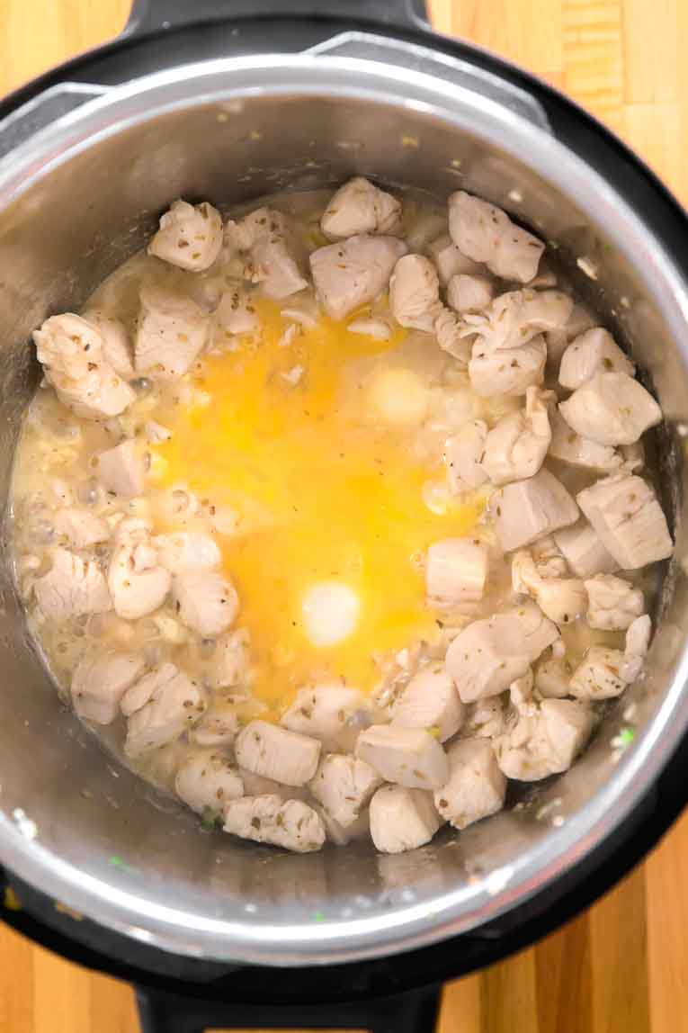 Eggs being scrambled with chicken in an Instant Pot.