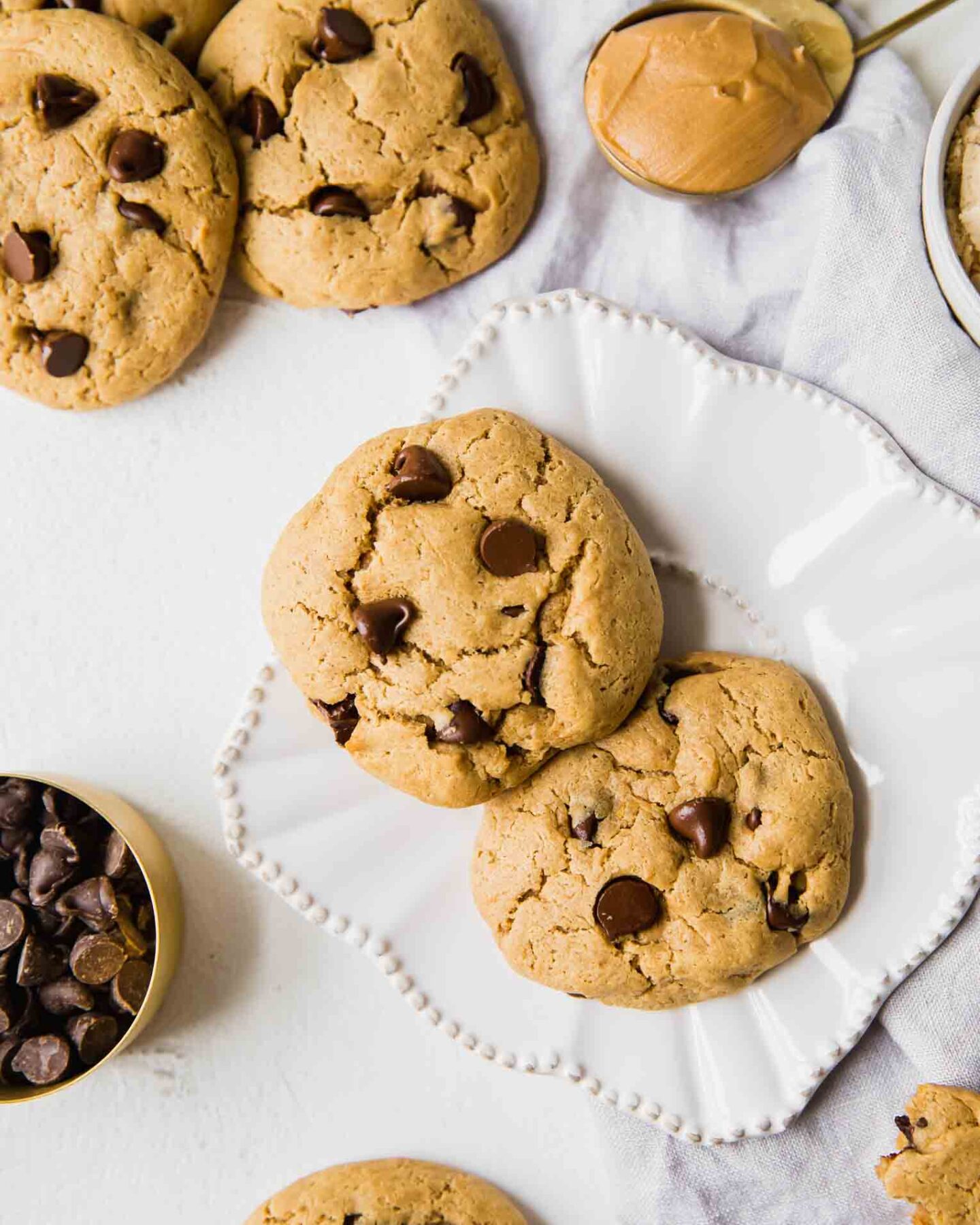 Close up top shot of protein cookies on a white plate.