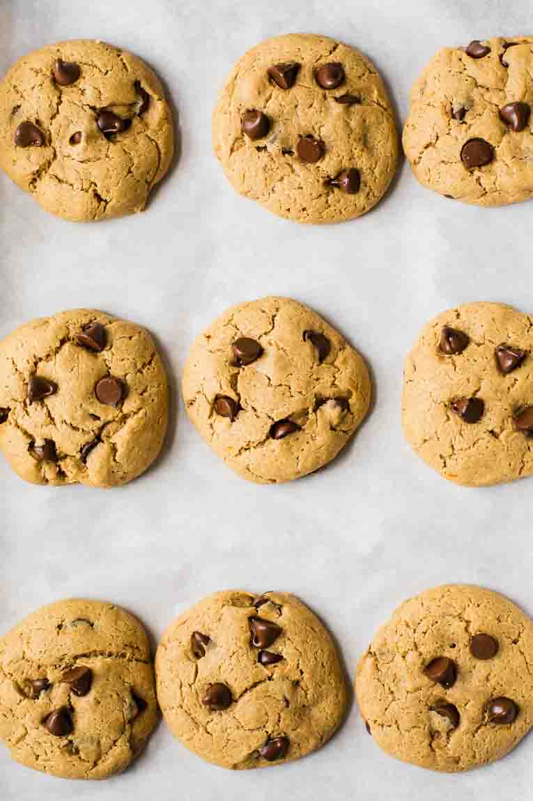 Protein cookies baked fresh out of the oven on parchment paper.