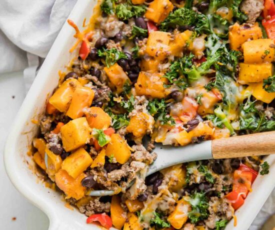 Spicy Southwest Butternut Squash Casserole with wooden spoon.