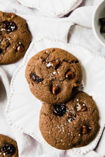 Close up of chocolate cherry soft cookies on a white plate.
