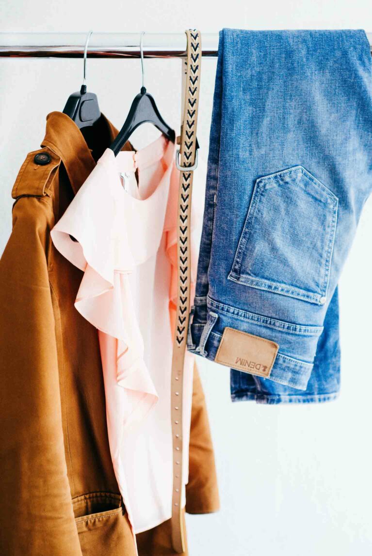 Clothes hanging on a rack.
