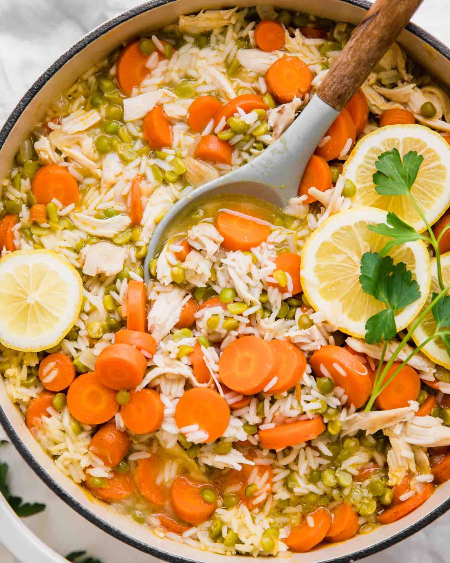 Top shot of Chicken Lemon Rice Soup in a dutch oven.