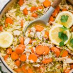 Top shot of Chicken Lemon Rice Soup in a dutch oven.