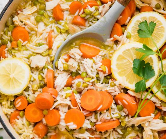 Top shot of Chicken Lemon Rice Soup in a dutch oven.