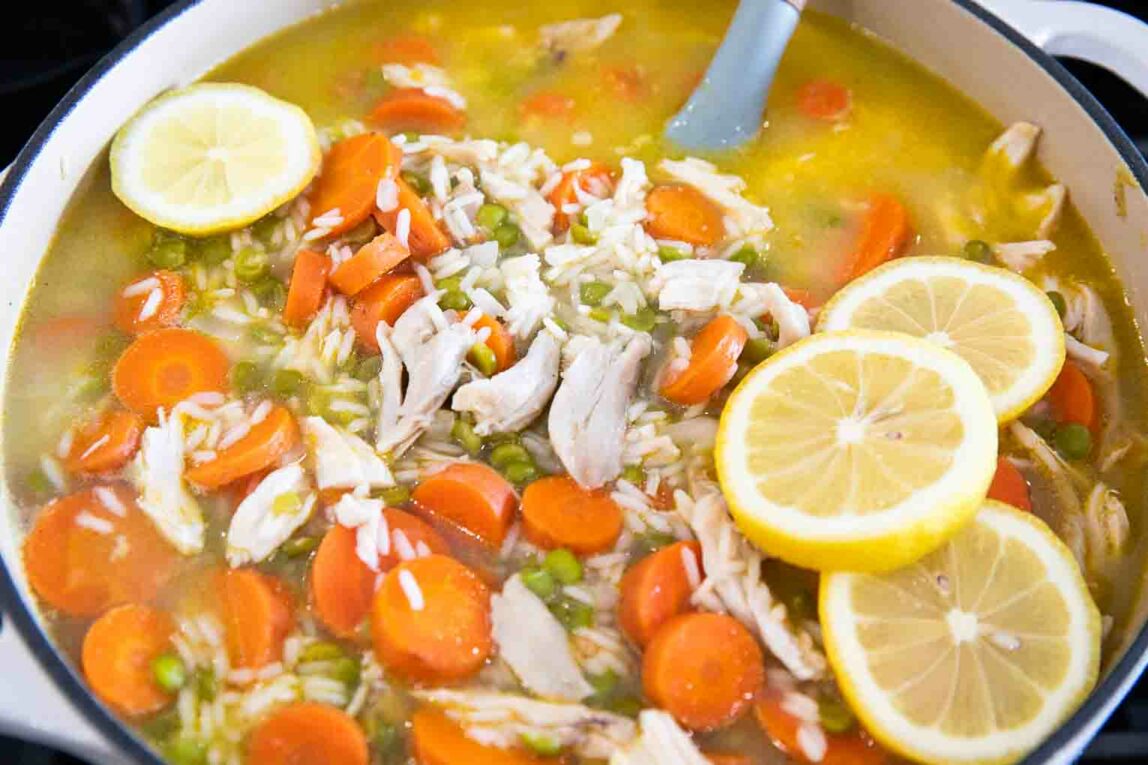 Chicken Lemon & Rice Soup being cooked in a dutch oven.