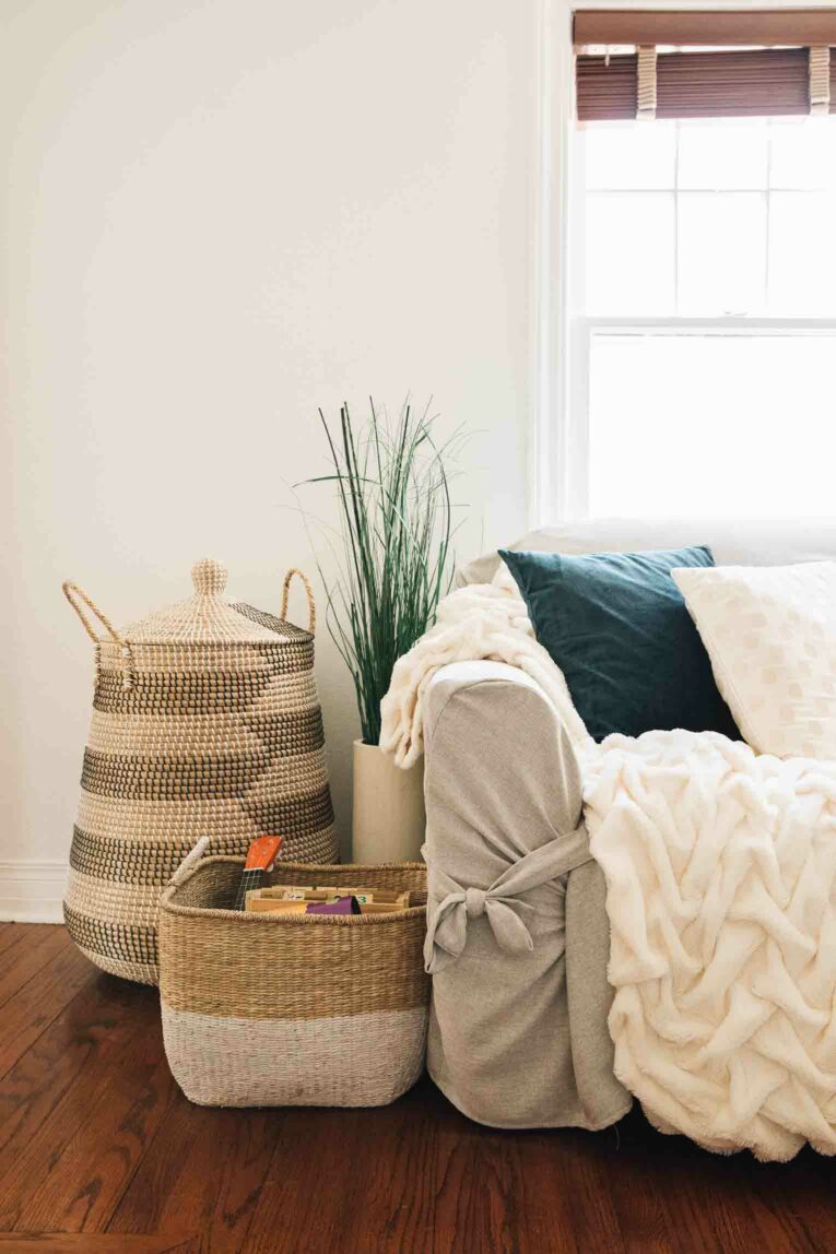 Living room with baskets for toy storage.