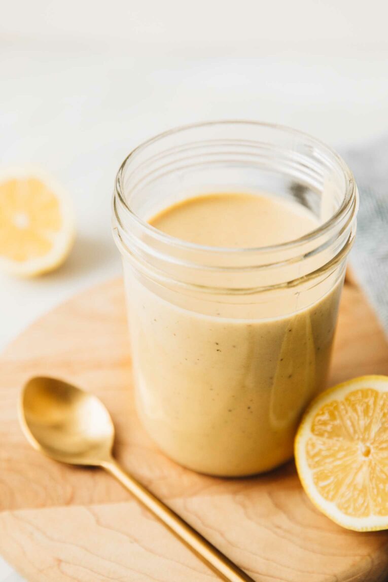 Angled shot of creamy lemon tahini dressing.