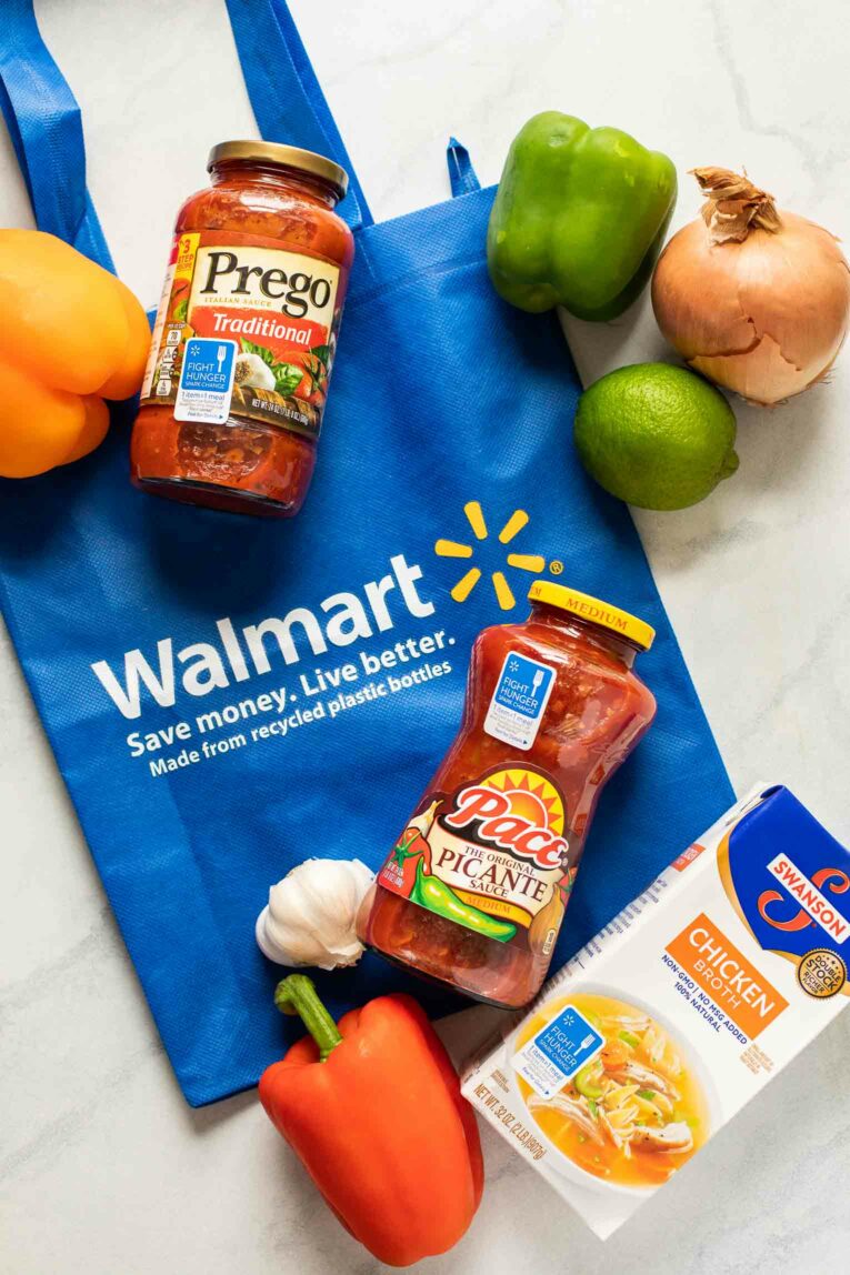 Walmart bag with ingredients for fajitas on top.