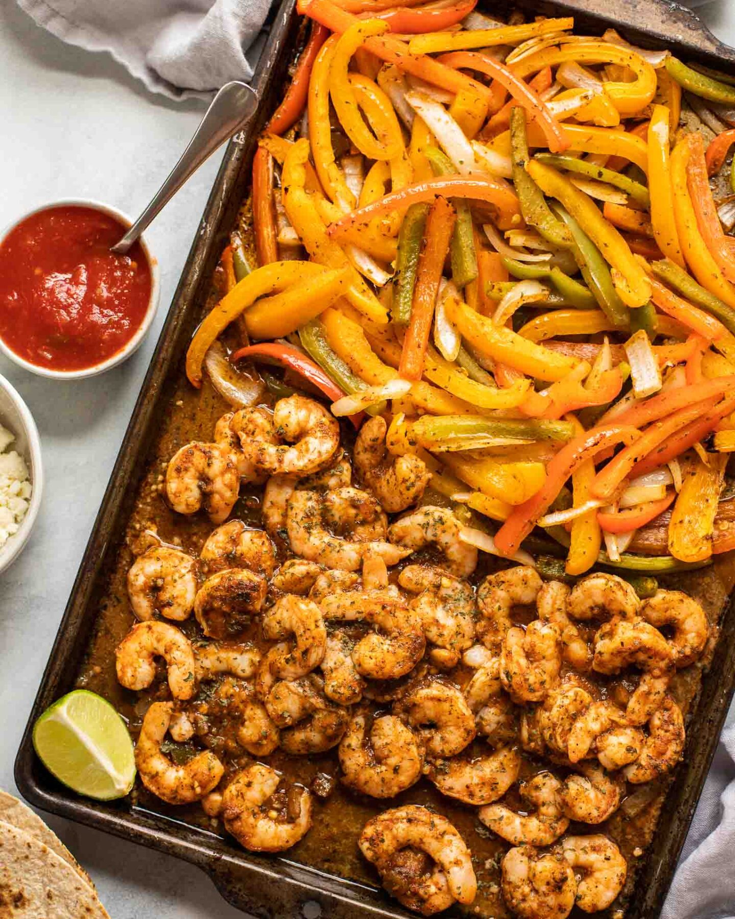 Sheet Pan Shrimp Fajitas on a baking pan.