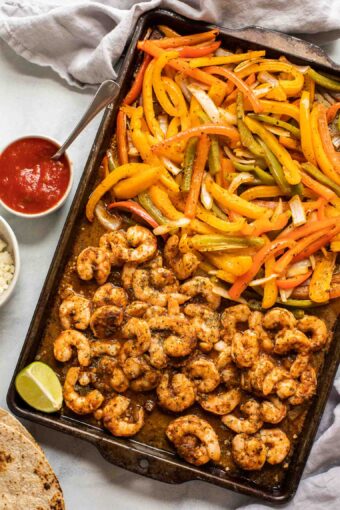 Sheet Pan Shrimp Fajitas on a baking pan.