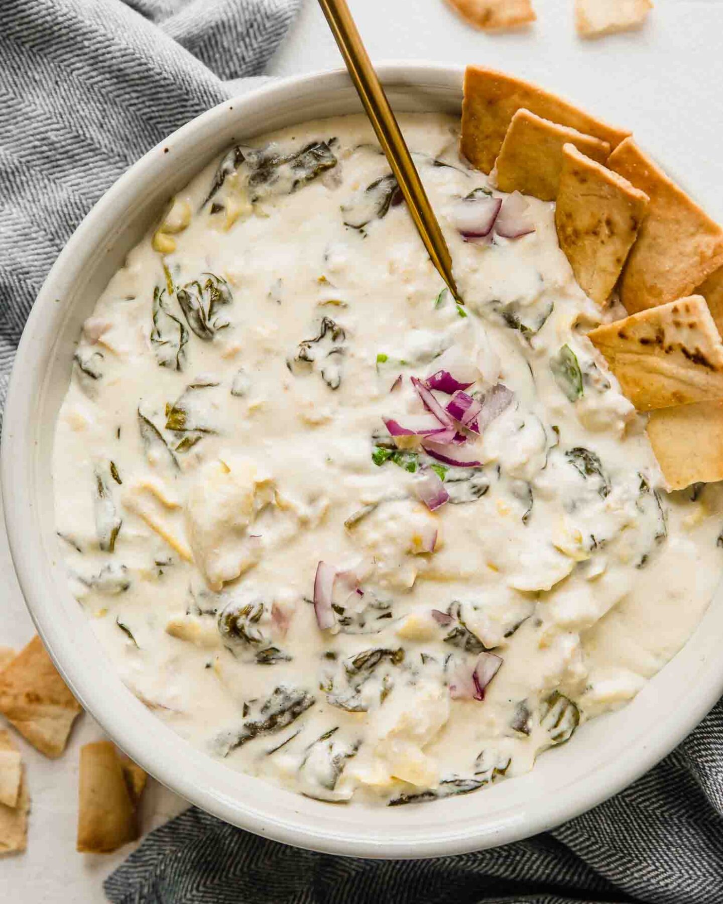 Top shot of Slow Cooker Spinach Artichoke Dip and chips.