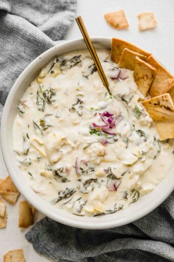 Top shot of Slow Cooker Spinach Artichoke Dip and chips.