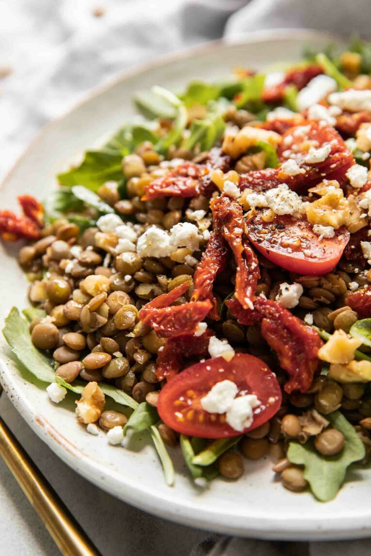 Angled shot of Sun-Dried Tomato & Arugula Lentil Salad.