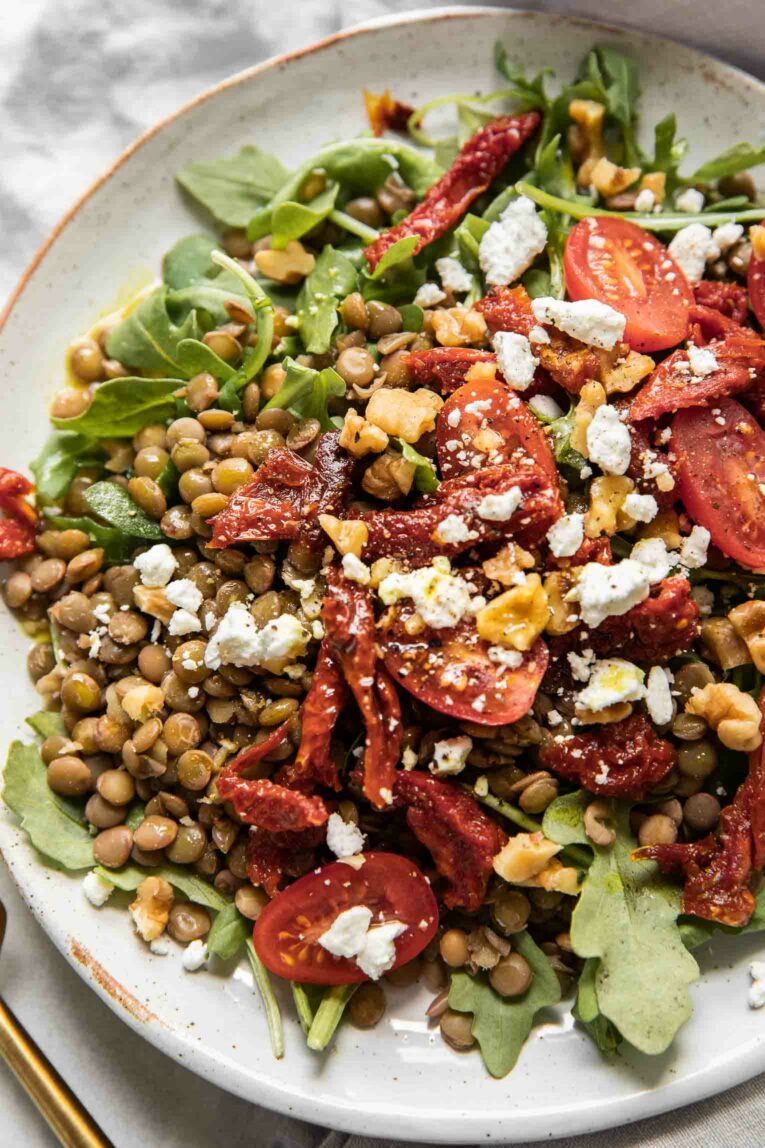 Close up of sun-dried tomato arugula lentil salad.