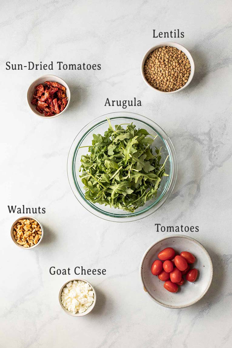 Ingredients for sun-dried tomato arugula lentil salad.