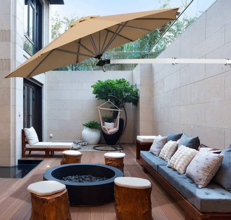 A patio with an umbrella over the top.