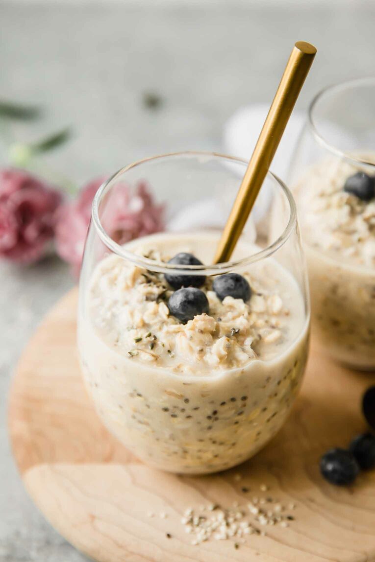 Angled shot of protein overnight oats on a wood board.