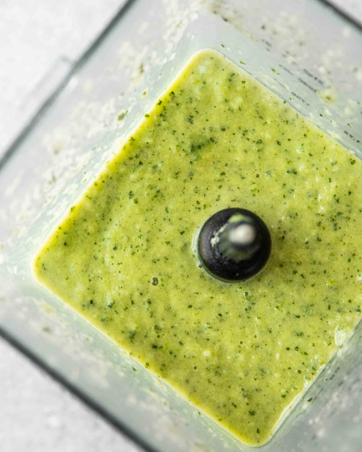 Green smoothie in a blender.