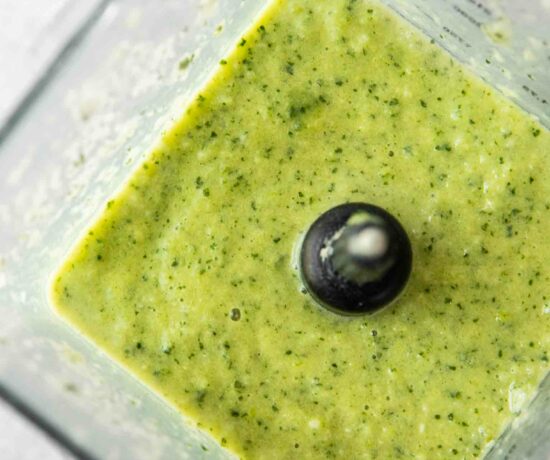 Green smoothie in a blender.