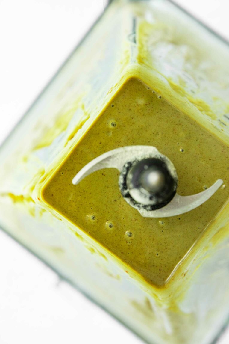 Matcha smoothie in a blender.