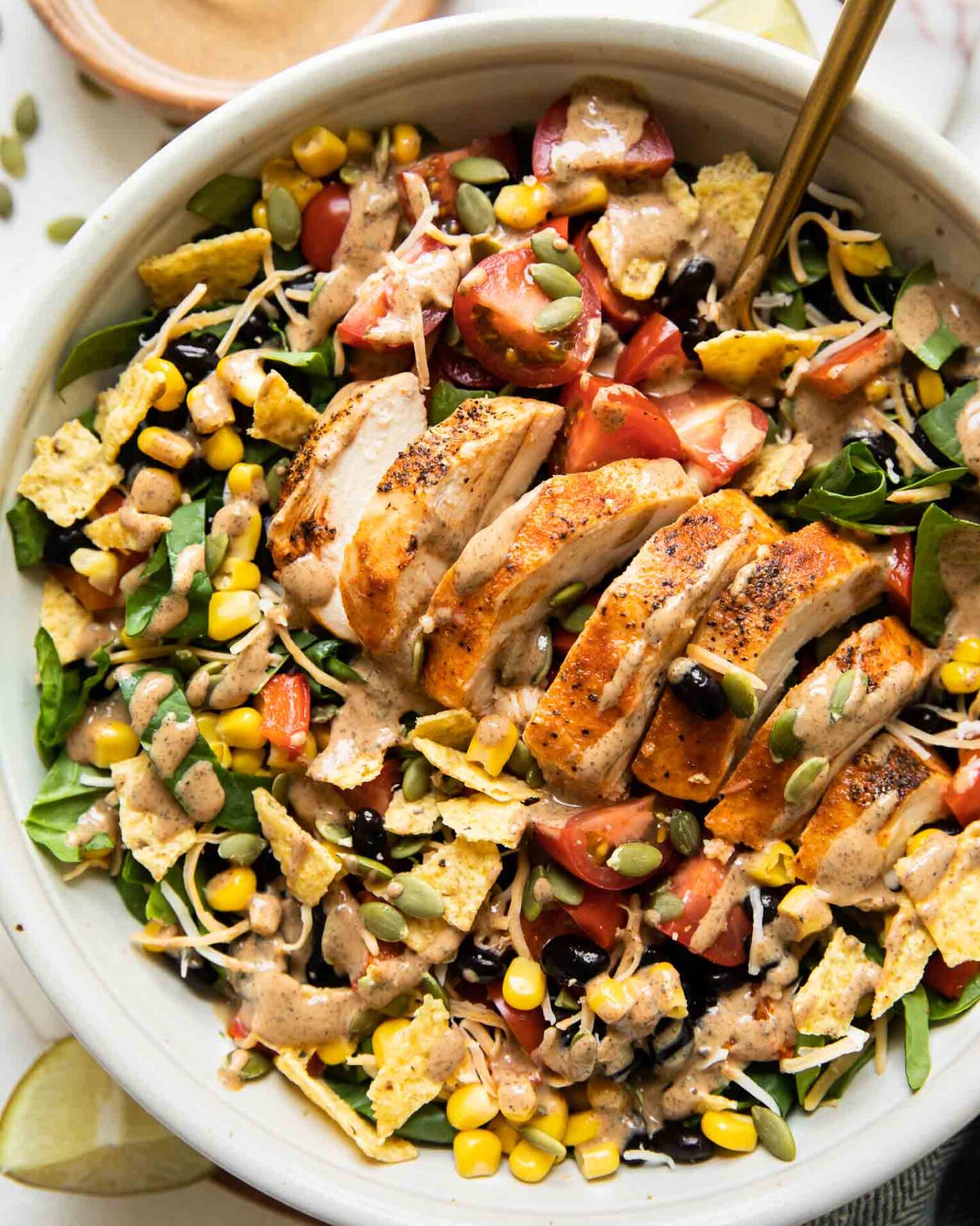 Top shot of Spicy Southwest Salad (Chick-Fil-A Copycat Recipe) in a white bowl.