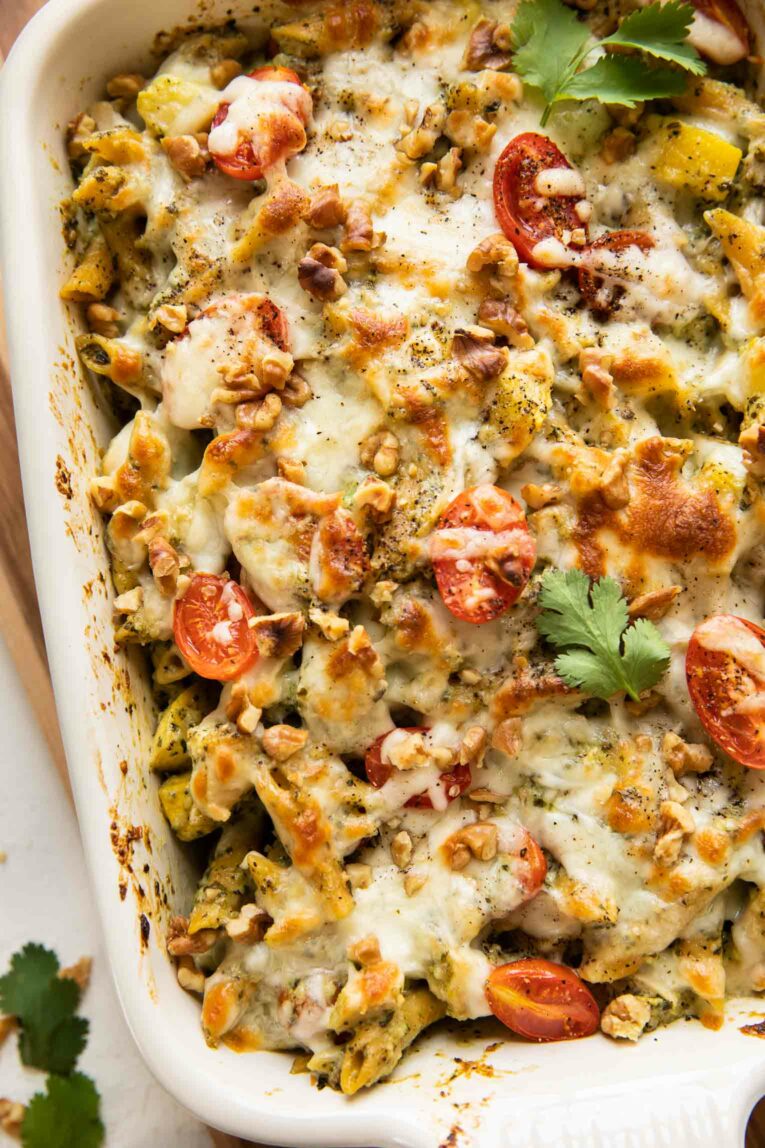Close up of Chicken Pesto Pasta Bake in a casserole dish.